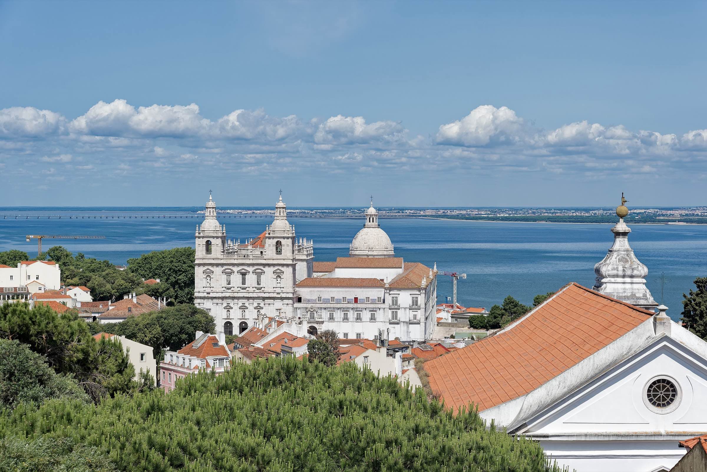 Rooftops of Alfama, Lisbon, turning gold at sunset