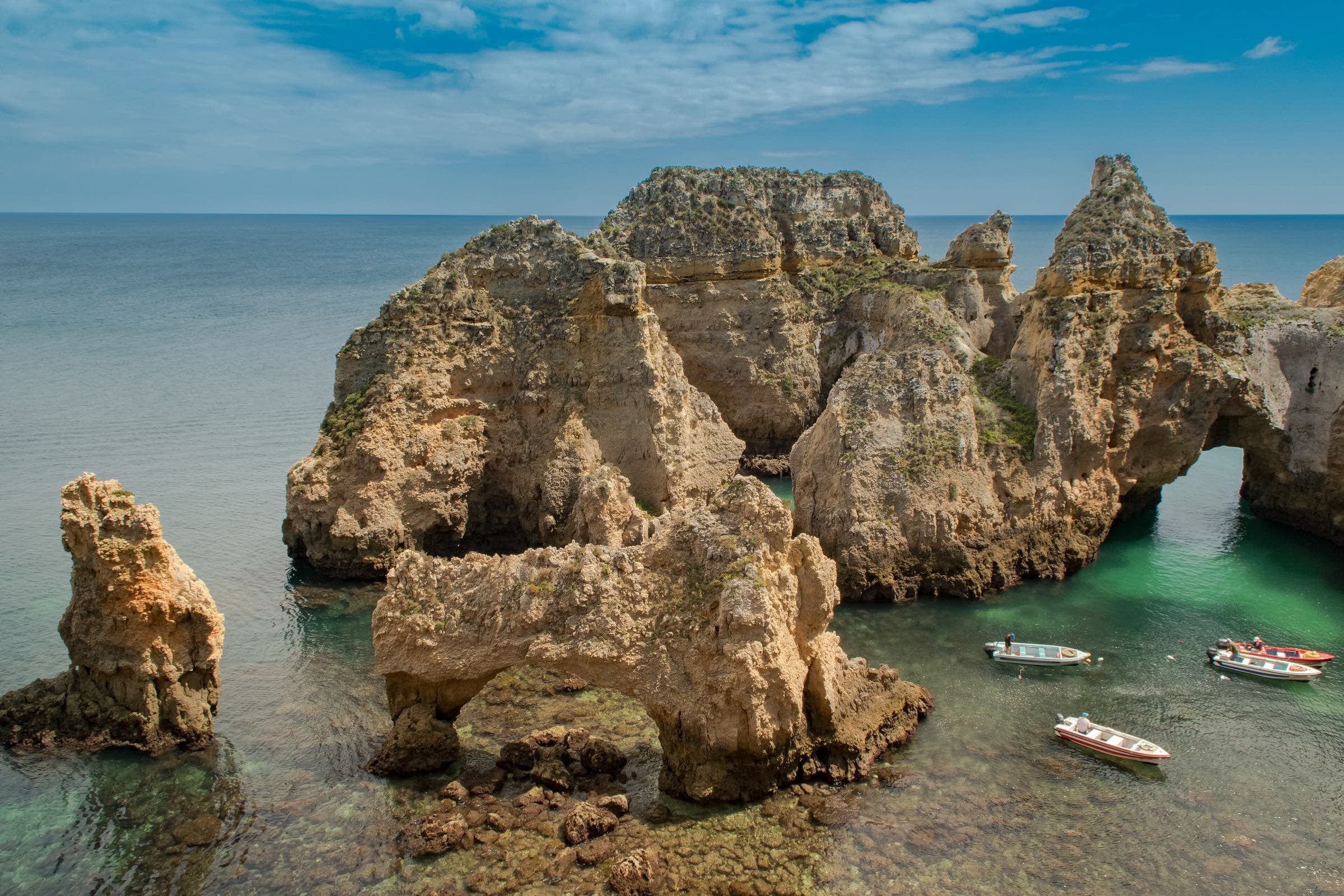 Golden cliffs over turquoise water on the Algarve coast