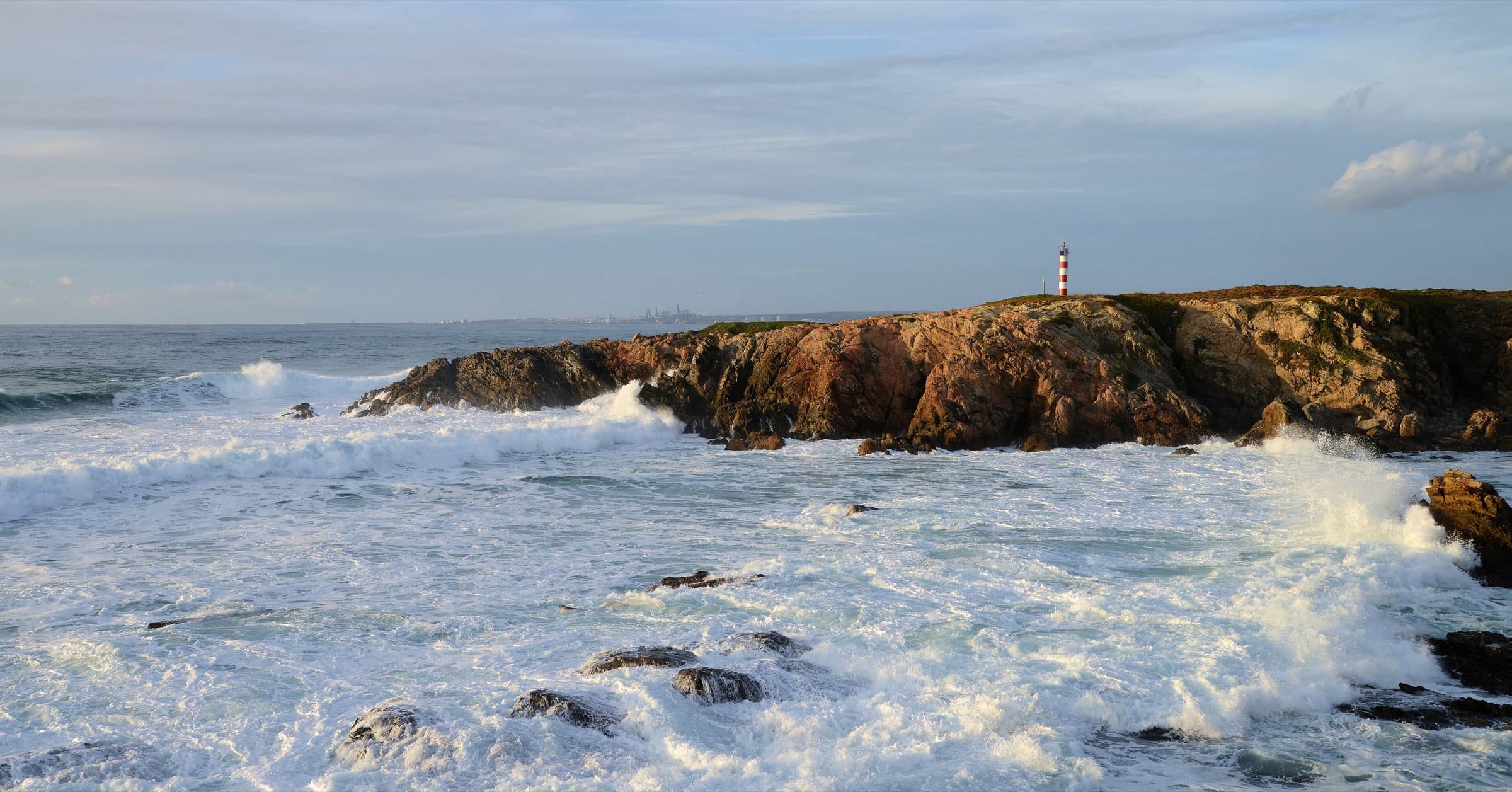 A calm Atlantic coastline at dusk