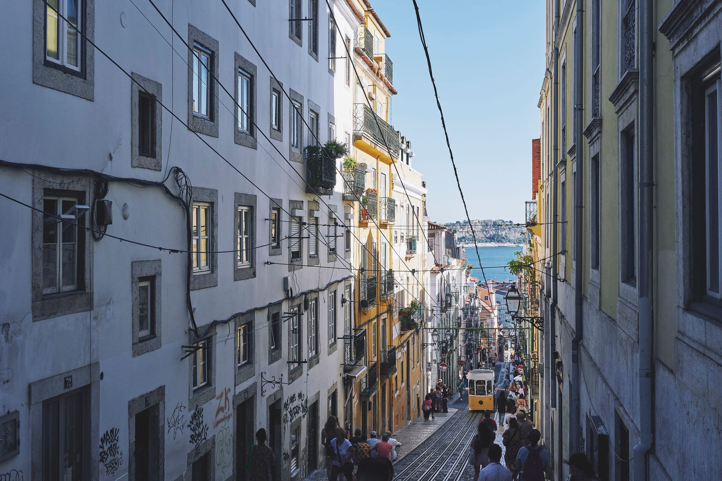 A dim, atmospheric Porto street in the evening